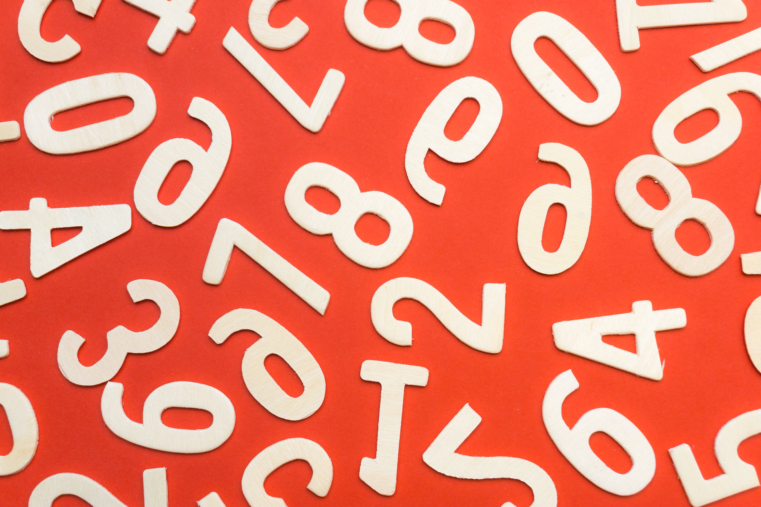 scattered wooden number cut outs